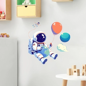 Détail d'autocollant mural astronaute avec terre et ballon pour chambre d'enfant