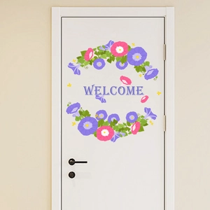 Detail of morning glory floral wreath wall sticker with welcome greeting on white door