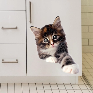 Realistic 3D peekaboo calico kitten wall sticker applied to modern white drawer cabinet