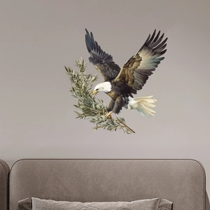 Watercolor bald eagle wall decal with olive branch above a bedroom headboard