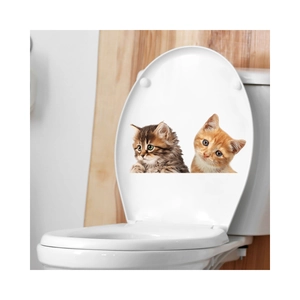 Detail of cute cat wall stickers showing 3D peering kittens on a white toilet lid