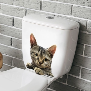 Detailed 3D cat sticker with tabby cat face and paws on white toilet tank surface
