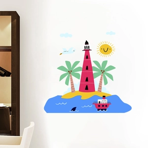 Detail of nautical wall decals with red lighthouse and palm trees in a kids bedroom