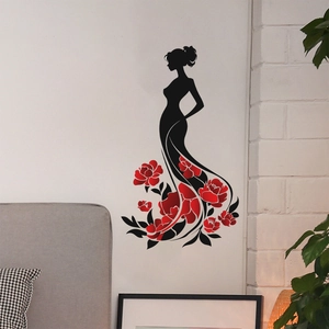 Detail view of artistic woman silhouette wall decal with red flower dress in a bedroom