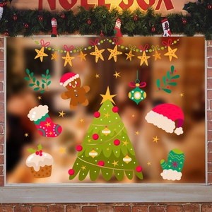 Detail of Christmas tree window decals with gingerbread man and festive wall stickers