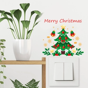 Detailed view of Merry Christmas switch sticker with festive tree and stars on wall
