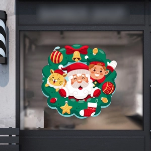 Détail macro de l'autocollant de Noël pour fenêtre avec Père Noël et couronne festive