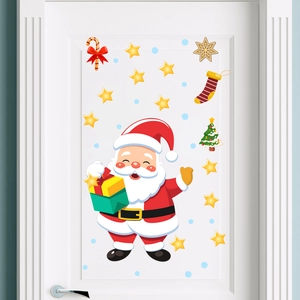 Autocollants Père Noël et étoiles festives posés sur une porte intérieure blanche décorée