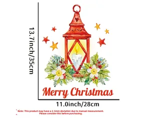 Detail view of Christmas sticker with lantern, holly and Merry Christmas greeting