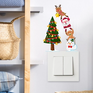 Cartoon Christmas wall stickers with Santa, reindeer and snowman over a light switch cover