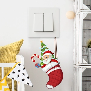 Detailed view of Christmas light switch stickers featuring Santa and festive icons