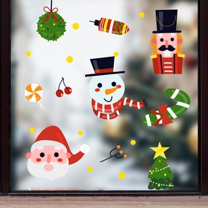 Christmas window decals with Santa Claus, Snowman and Nutcracker on glass surface