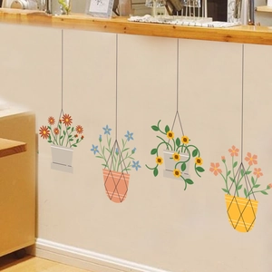 Macro detail of four hanging potted plant wall stickers in floral and sunflower designs
