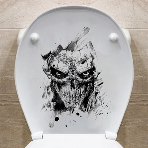 Skull decal on white toilet lid, black and white sketch style for Halloween decor