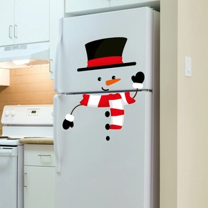 Detail of cute snowman refrigerator stickers with black hat and red scarf for Christmas