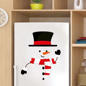 Detailed view of waterproof PVC snowman stickers on a white refrigerator for Christmas