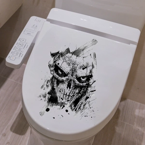 Detail of artistic skull decal on a modern smart toilet lid for Halloween decor