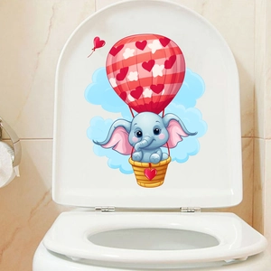 Detail of blue elephant in a hot air balloon bathroom sticker on a white toilet lid