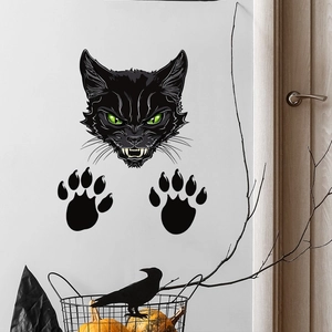 Adesivo murale Halloween gatto nero con occhi verdi e impronte di zampe su parete