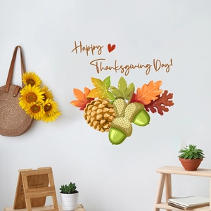 Detail showing Happy Thanksgiving Day wall decal with maple leaves and pine cones on white wall