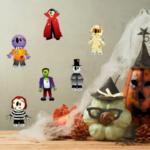 Detailed view of glow-in-the-dark Halloween stickers with cute vampire and ghost characters