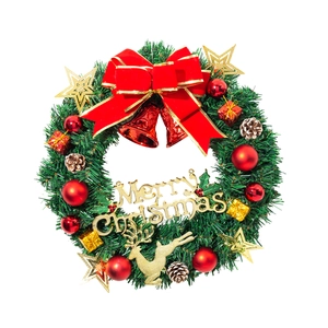 Christmas pine needle wreath with red bow, golden reindeer, and Merry Christmas sign decoration