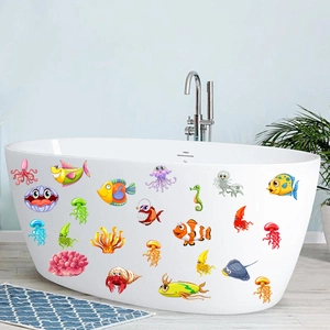Luminous cartoon marine life wall stickers on a modern bathtub for bathroom decor
