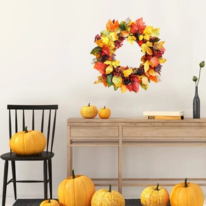 Autumn maple leaf wreath with berries for home wall decoration and festive holiday ornaments