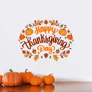Happy Thanksgiving wall decal with pumpkin and maple leaf motifs on white wall