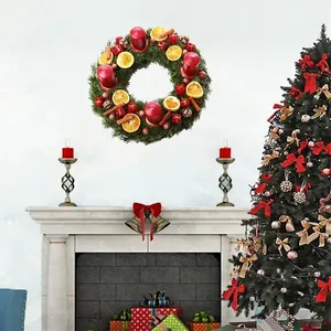 Christmas wreath wall sticker with candles orange slices and cinnamon on fireplace background
