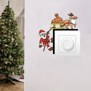 Sticker mural de Noël représentant le Père Noël et un renne sur un interrupteur blanc