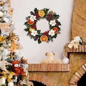Christmas wall decal with orange slices, pine cones and red berries in wreath design