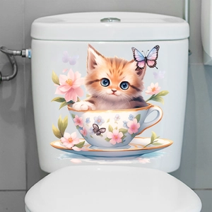 Detail showing a cute orange cat in a teacup floral wall sticker on a white toilet tank