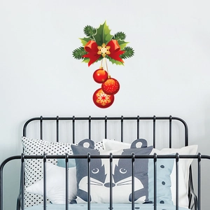 Detail view of festive Christmas wall stickers with red ornaments and green leaves decoration