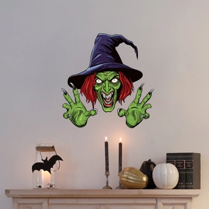 Creepy green-faced witch wall decal above fireplace with pumpkins for Halloween decor