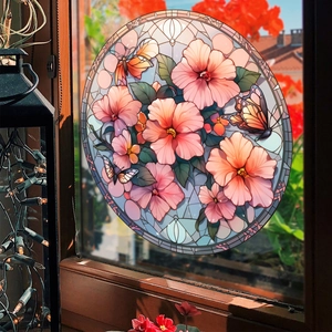 Detail of colorful stained glass window cling with butterflies and pink hibiscus flowers
