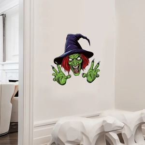 Green witch wall sticker for Halloween decor with purple hat on white indoor wall