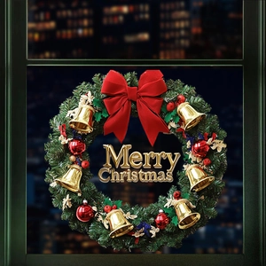 Christmas wreath with red bow, golden bells, and Merry Christmas sign on window