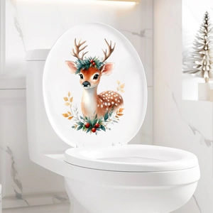 Detail of Christmas reindeer toilet lid sticker with berries and leaves in a modern bathroom