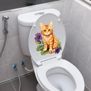 Detail of waterproof cat and purple flower sticker on a white toilet lid in bathroom