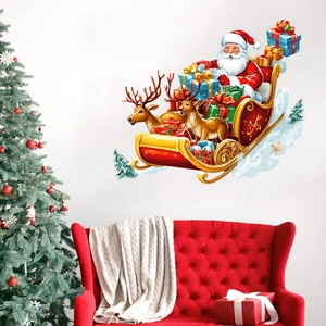 Christmas wall stickers featuring Santa on a reindeer sleigh with festive gifts on a white wall