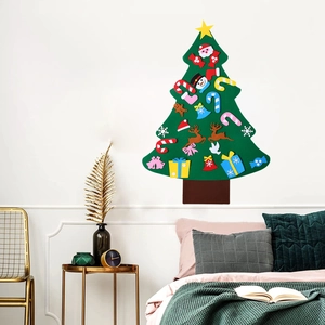 Detail of DIY felt Christmas tree on wall with various festive ornaments and Velcro patches