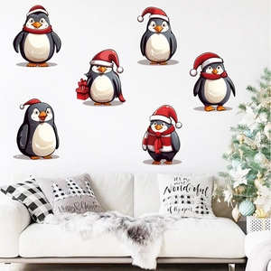 Cozy home interior featuring cartoon penguin wall stickers and a festive Christmas tree