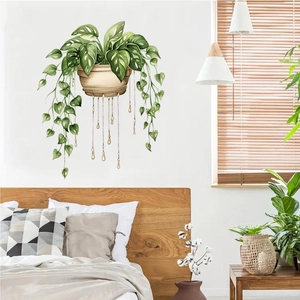 Detailed wall sticker showing hand-painted green plants hanging in a cozy bedroom scene