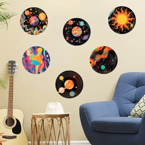 Detailed view of six colorful vinyl record wall stickers arranged on a modern living room wall