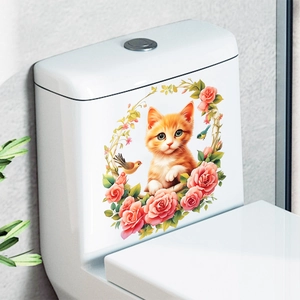 Detailed view of a cute orange kitten and pink rose wreath sticker on a white toilet tank