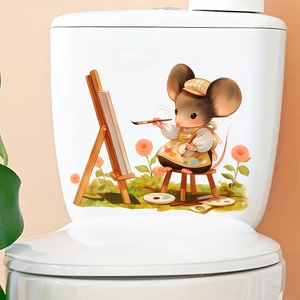 Dettaglio di un adesivo con topolino pittore applicato sulla vaschetta del WC in ceramica