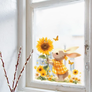 Détail d'un sticker de fenêtre lapin mignon tenant un tournesol sur une vitre claire