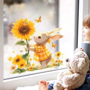 Détail d'un autocollant de fenêtre montrant un lapin blanc mignon avec un tournesol