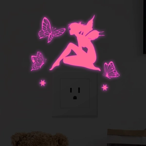 Luminous pink fairy and butterflies wall stickers glowing in the dark around a switch